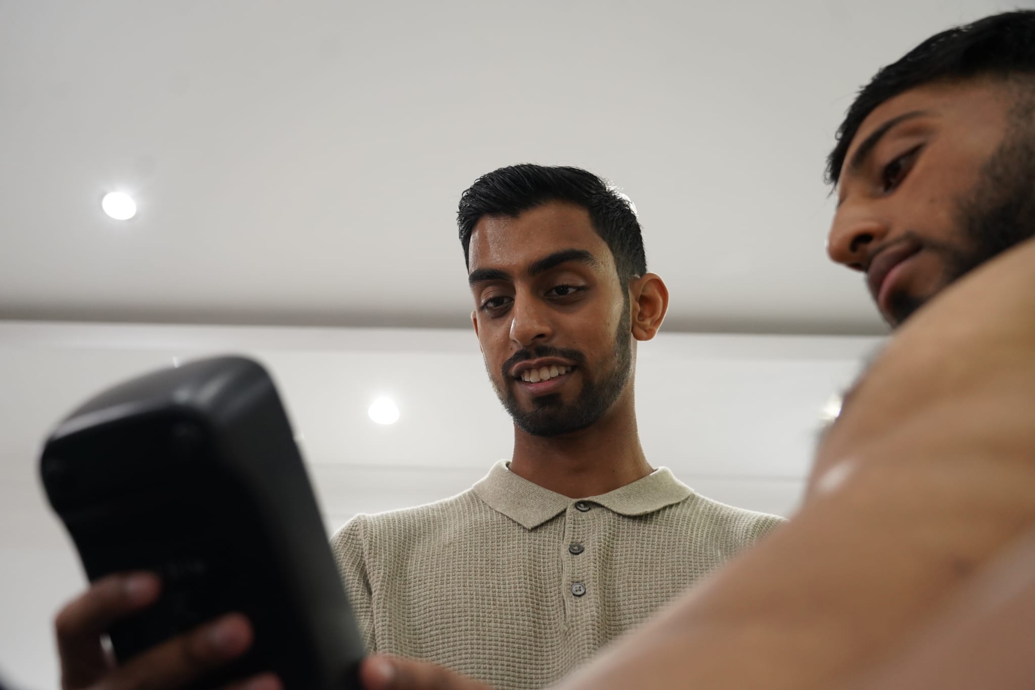 Momin talking with a client during consultation